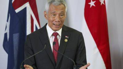 Lee Hsien Loong - Lawrence Wong - Singapore PM Lee to step down on May 15 and hand power to his deputy - apnews.com - Singapore -  Singapore - county Lee - county Lawrence