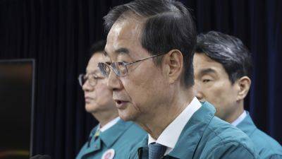 KIM TONGHYUNG - Han Duck - South Korea slows plan to hike medical school admissions as doctors’ strike drags on - apnews.com - South Korea -  Seoul, South Korea