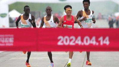Nectar Gan - Beijing half marathon winners stripped of medals after African trio let Chinese runner win - edition.cnn.com - China -  Beijing - Hong Kong - Kenya - Ethiopia