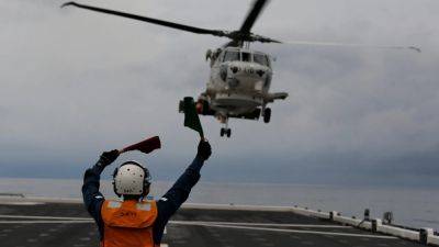 Japan searches for 7 missing at sea after navy helicopters lost over Pacific