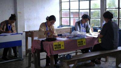AP PHOTOS: For the world’s largest democratic exercise, one village’s polling officers are all women - apnews.com - India