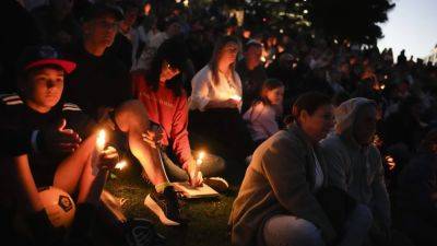 In Australia, crowds join Bondi Beach candlelight memorial for mall stabbing victims