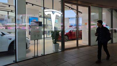 Tesla slides 4%, Li Auto sinks 8% as EV makers slash prices amid fierce competition