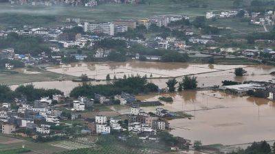 Massive floods threaten tens of millions as intense rains batter southern China