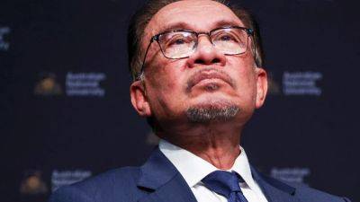 Backlash in Malaysia to Najib’s house arrest bid rains on PM Anwar’s PKR parade