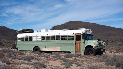 This couple lives in a school bus they converted into a luxury tiny home—take a look inside