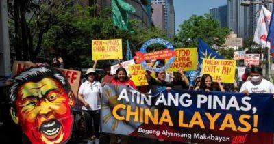 Xi Jinping - Thomas Shoal - Philippine protesters trample on Xi effigy, condemn China's maritime 'aggression' - asiaone.com - China - Philippines - city Beijing - city Manila