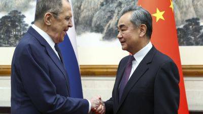 Xi Jinping - Wang Yi - Volodymyr Zelensky - China’s Xi meets with Russian Foreign Minister Lavrov in show of support against Western democracies - apnews.com - China - Russia -  Beijing -  Shanghai -  Moscow - Ukraine