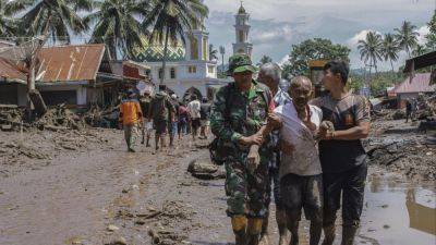 34 dead in Indonesia, 16 missing, after Sumatra struck by floods, volcanic material