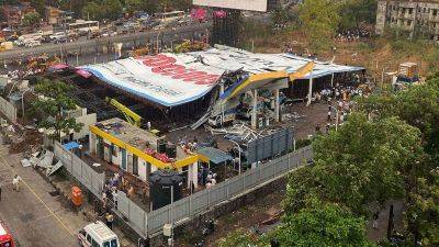 Four dead, several feared trapped as billboard falls over during Mumbai rainstorm