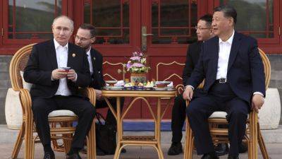 Xi Jinping - Vladimir Putin - THE ASSOCIATED PRESS - Arvind Kejriwal - Shuji Kajiyama - AP Week in Pictures: Asia - apnews.com - city Tokyo - China - Russia - city Beijing - Indonesia - India - city New Delhi - region Asia-Pacific