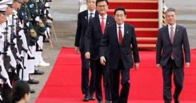 China's premier hails 'new beginning' with US-allied South Korea, Japan