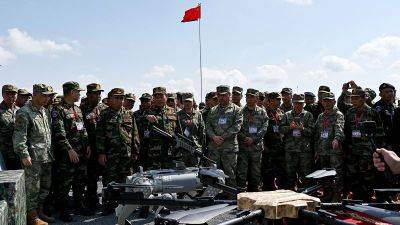 Brad Lendon - China’s military shows off rifle-toting robot dogs - edition.cnn.com - China - Usa - Russia - Thailand - Malaysia - Cambodia - Vietnam - Laos