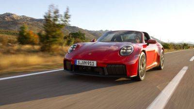 Michael Wayland - Porsche reveals first-ever 911 hybrid sports car, starting at $164,900 - cnbc.com - Germany