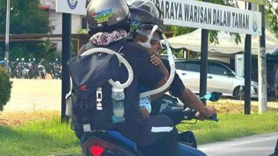 Malaysian couple who went viral for riding motorbike with sick baby on respirator get married