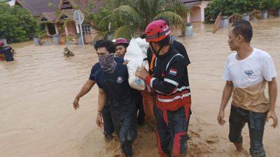 Edna Tarigan - Abdul Muhari - Flood and landslide hit Indonesia’s Sulawesi island, killing 14 - apnews.com - Indonesia -  Jakarta, Indonesia - province Sulawesi