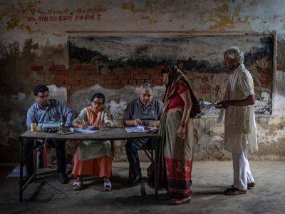 Modi votes in home state as mammoth India election hits half-way mark