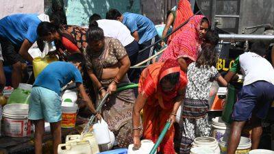 A scorching heat wave kills 14 in India ahead of a final round of election voting on Saturday