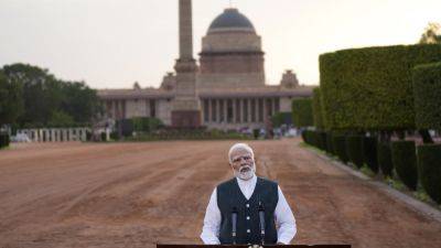 Indian PM Modi names Cabinet for coalition government after his party lost majority
