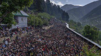 AP PHOTOS: Nomadic Muslim devotees throng a forest shrine in disputed Kashmir