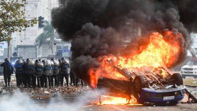 Sam Meredith - Javier Milei - Argentina's Senate passes Milei's economic reform bill as protesters clash with riot police - cnbc.com - Argentina