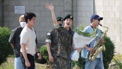 Louis Vuitton - Jin, oldest member of K-pop’s BTS, finishes army service in South Korea - edition.cnn.com - South Korea -  Seoul - Italy - province Gyeonggi