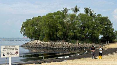 Singapore’s Sentosa beaches closed after oil spill from ship collision at Pasir Panjang Terminal