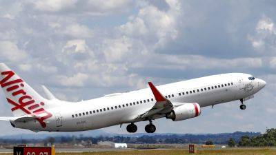 Virgin Australia plane engine catches fire in New Zealand after ‘possible bird strike’