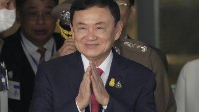 JINTAMAS SAKSORNCHAI - Thaksin Shinawatra - Prayuth Bejraguna - Thaksin indicted on charge of royal defamation as more court cases stir Thailand’s political woes - apnews.com - Thailand - South Korea -  Bangkok