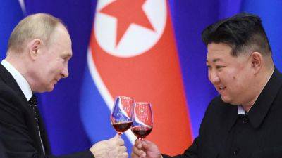 Putin says Russia may change its nuclear doctrine, warns South Korea not to aid Ukraine