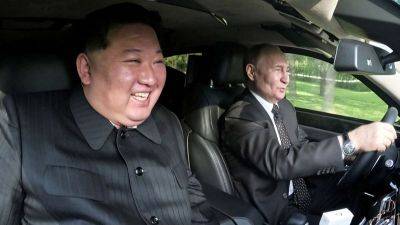 Vladimir Putin - Kim Jong - Putin and Kim seen laughing in Russian-made limousine after inking mutual defense pact - edition.cnn.com - Russia - North Korea - Ukraine - city Pyongyang