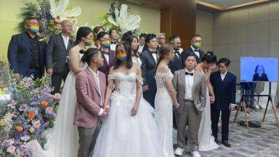 A US officiant marries 10 same-sex couples in Hong Kong via video chat - apnews.com - China - Taiwan - Usa - Hong Kong - Singapore - state Utah - city Hong Kong