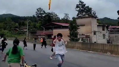 Xi Jinping - Nectar Gan - Suspected Chinese rocket debris seen falling over village after launch, video shows - edition.cnn.com - France - China - Usa - Hong Kong - province Guizhou
