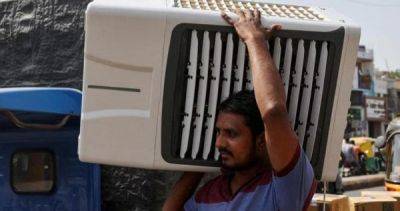 Indians battle intense heat with 'mad rush' for air conditioners, beer