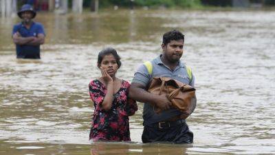 BHARATHA MALLAWARACHI - Sri Lanka closes schools as floods and mudslides leave 10 dead and 6 others missing - apnews.com - Sri Lanka