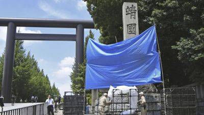 MARI YAMAGUCHI - Japan police search for suspects in spray-painting of graffiti at controversial war shrine - apnews.com - Japan -  Tokyo - China - Britain