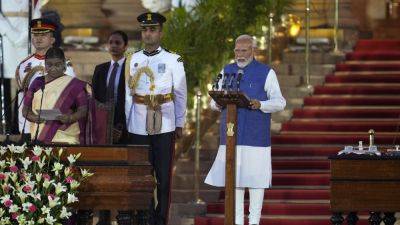 Relying on coalition partners, Modi is sworn in for a rare third term as India’s prime minister