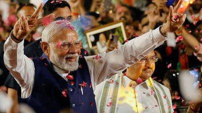 Modi is sworn in for a rare third term as India’s prime minister