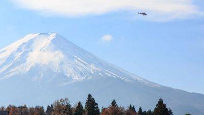 In Japan, Mount Fuji hiking season begins with new crowd control measures