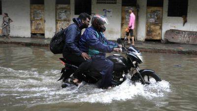Reuters - Heavy rains in India’s Mumbai flood roads, shut schools, cancel flights: ‘tough for people’ - scmp.com - India - Nepal - state Bihar - city Mumbai, India