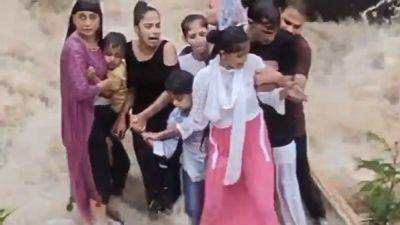 Video shows tragic moment an Indian family is swept away by floodwaters - aljazeera.com - India