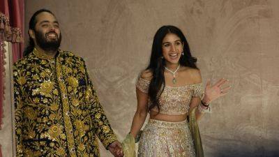 Narendra Modi - Mukesh Ambani - Asia’s richest man Mukesh Ambani is set to throw a grand wedding for his son. Here’s what to know - apnews.com - France - India - Italy - city New Delhi - city Mumbai