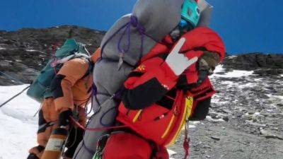 Associated Press - Clearing Mount Everest’s highest camp of frozen garbage to take years - scmp.com - Malaysia - Nepal