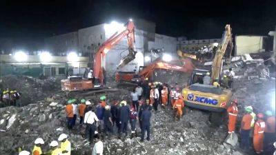 At least seven people killed, several feared trapped in India building collapse
