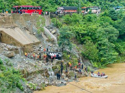 At least 60 people missing in a landslide tragedy that swept buses away - aljazeera.com - Nepal