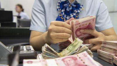 Institutions snapping up Chinese treasury bonds are shorting the economy, state media says