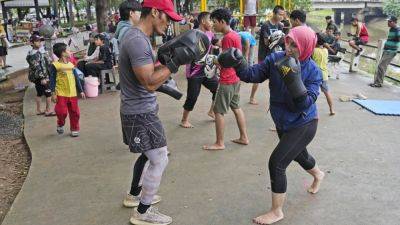 Indonesian women assert themselves with martial arts as gender-based violence remains a challenge