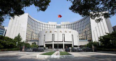 China Unexpectedly Cuts Interest Rate as World Markets Sag