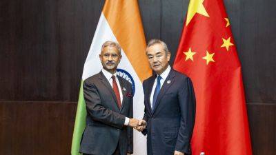 Wang Yi - Subrahmanyam Jaishankar - India and China agree to work urgently to achieve the withdrawal of troops on their disputed border - apnews.com - China - India - Laos - city New Delhi