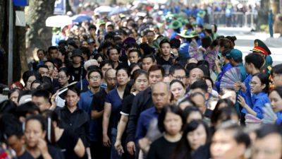 Joe Biden - Nguyen Phu - Han Duck - Vietnam Communist Party chief’s funeral draws thousands of mourners, including world leaders - apnews.com - Japan - China - India - South Korea - Vietnam - Cuba - city Hanoi, Vietnam